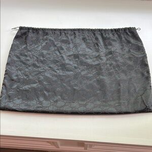 Gucci Black silk dust cover
20”wide X 13.50” tall